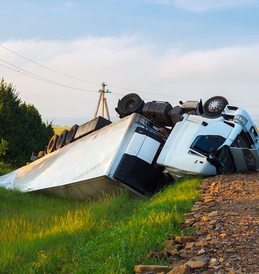 a semi truck crashes and rolls down a hill